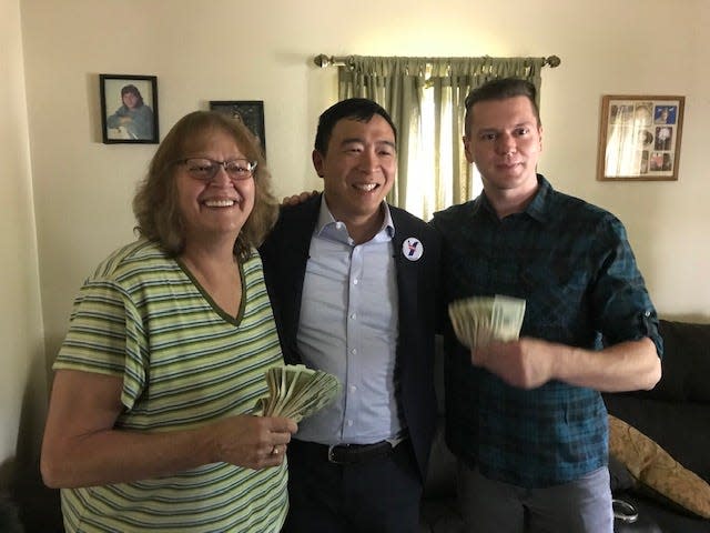 In 2019, then-presidential candidate Andrew Yang, center, named Kyle Christensen of Iowa falls, left, to receive $1,000 a month for 12 months from Yang. Kyle's mother, Pam Christensen is also pictured with them. Yang wanted to illustrate how his Freedom Dividend, a form of universal basic income would work. Civil Rights icon the Rev. Martin Luther King Jr. also advocated for a guaranteed income.