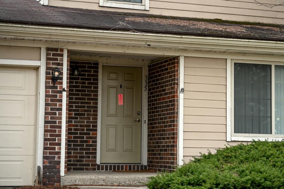 One of several pink tagged units at Autumn Ridge Apartments on Monday, April 4, 2023, in Lansing.