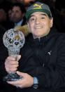 Argentinian soccer legend Diego Armando Maradona holds the prize received during the Italian soccer Hall of Fame 2017 event in Florence, Italy, January 17, 2017. REUTERS/Paolo Lo Debole