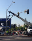 Putting the street lights back together after the #Endeavour went through. (Photo courtesy of <a href="https://twitter.com/torrey_ynews/" rel="nofollow noopener" target="_blank" data-ylk="slk:@torrey_ynews;elm:context_link;itc:0;sec:content-canvas" class="link ">@torrey_ynews</a>)