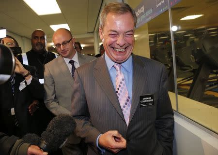 Nigel Farage, leader of the United Kingdom Independence Party (UKIP), arrives for the by-election ballot count at Medway Park in Gillingham, southeast England, November 21, 2014. REUTERS/Suzanne Plunkett