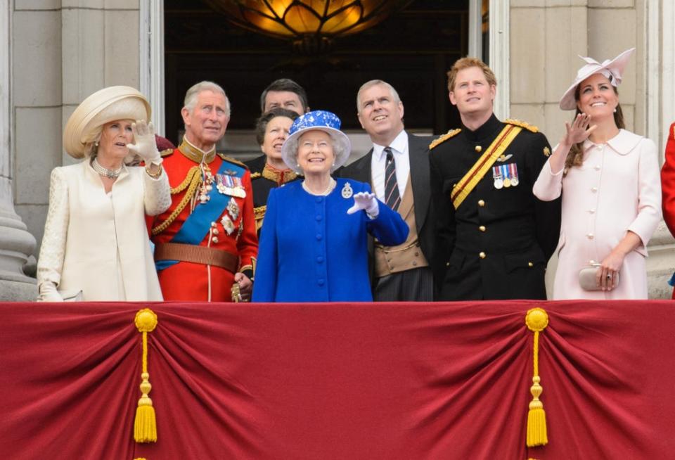 The Duke of York next to his mother on the balcony of Buckingham Palace in 2013 (PA) (PA Archive)