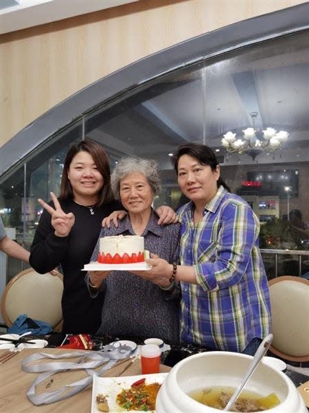Xiaojie "Emily" Tan's family in China celebrated what would have been her 50th birthday this week. Tan's mother, center, had not been told of her daughter's death because family members were worried it would make her sick.