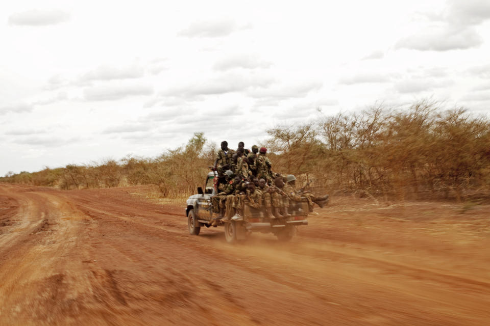 Sudan People's Liberation Army soldiers drive toward frontline positions near Pana Kuach, South Sudan on Friday May 11, 2012. In late April, tensions between Sudan and South Sudan erupted into conflict along their poorly defined border. Thousands of SPLA forces have been deployed to Unity State where the two armies are at a tense stalemate around the state's expansive oil fields. Fighting between the armies lulled in early May after the U.N. Security Council ordered the countries to resume negotiations. (AP Photo/Pete Muller)