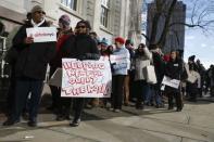 Supporters of Airbnb stand during a rally before a hearing called "Short Term Rentals: Stimulating the Economy or Destabilizing Neighborhoods?" at City Hall in New York, U.S. on January 20, 2015. REUTERS/Shannon Stapleton/File Photo