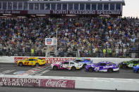 Joey Logano (22) leads the field at the start of the NASCAR All-Star auto race at North Wilkesboro Speedway in North Wilkesboro, N.C., Sunday, May 19, 2024. (AP Photo/Chuck Burton)