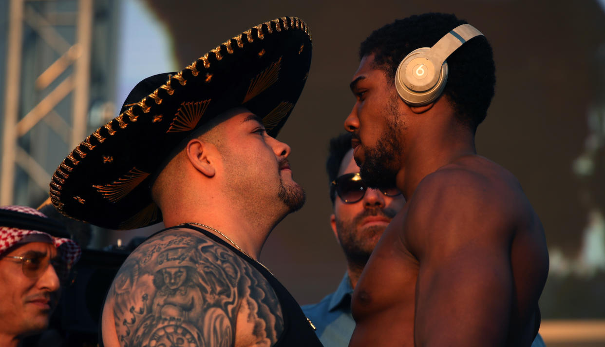 Andy Ruiz Jr (left) and Anthony Joshua during the weigh in at the Al Faisaliah Hotel in Riyadh, Saudi Arabia.