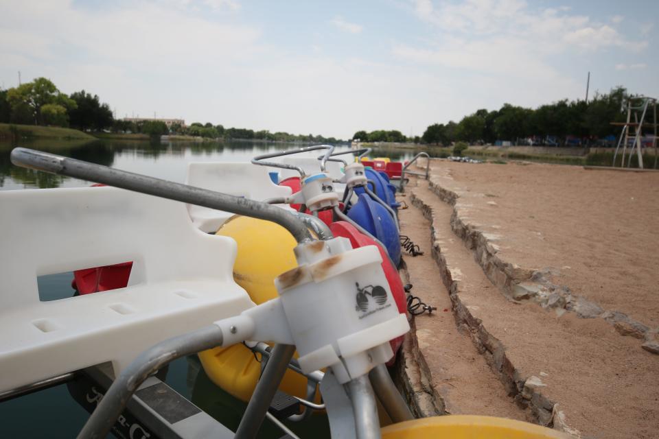 A line of aqua cycles sit at the read for rental, June 23, 2023 at River Hut in the Carlsbad beach area.