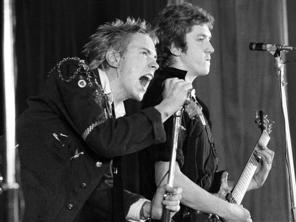 Johnny Rotten (John Lydon) and Steve Jones performing as The Sex Pistols in 1976 (Ian Dickson/Shutterstock)