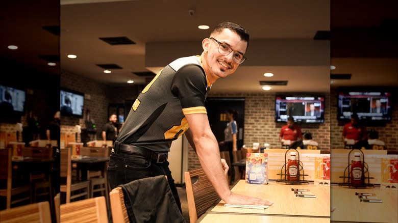 employee smiling at restaurant