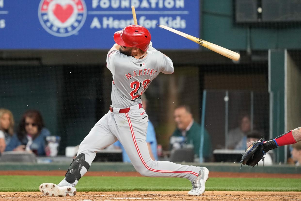 Designated hitter Nick Martini has his bat broken on a ground out in the fifth inning of the Reds' 4-3 loss to the Rangers in Texas Sunday. The Reds start a three-game series at the San Diego Padres at 9:40 p.m. Monday night.