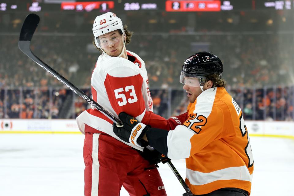 Moritz Seider of the Detroit Red Wings and Brendan Lemieux of the Philadelphia Flyers tangle during the second period at Wells Fargo Center in Philadelphia on Sunday, March 5, 2023.