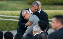 US President Barack Obama hugs Shigeaki Mori, a survivor of the atomic bombing of Hiroshima, at the Hiroshima Peace Memorial Park cenotaph on May 27, 2016