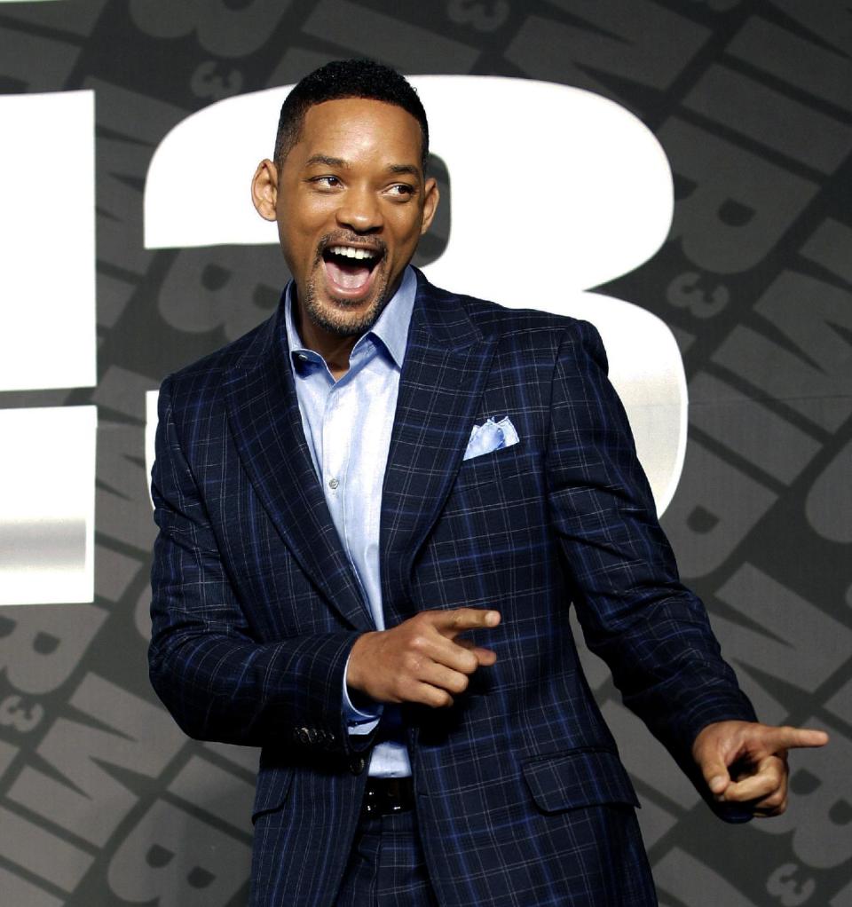 Actor Will Smith poses upon his arrival for a press conference to promote his new movie "Men in Black III" in Seoul, South Korea, Monday, May 7, 2012. (AP Photo/Lee Jin-man)