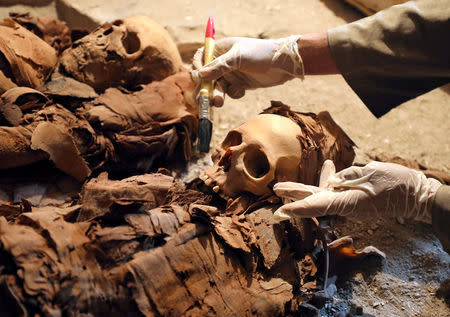 An Egyptian antiquities worker is seen in the recently discovered tomb of Amenemhat, a goldsmith from the New Kingdom, at the Draa Abu-el Naga necropolis near the Nile city of Luxor, south of Cairo, Egypt, September 9, 2017. REUTERS/Mohamed Abd El Ghany