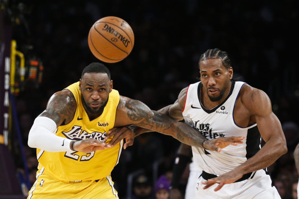 Los Angeles Lakers' LeBron James and Los Angeles Clippers' Kawhi Leonard led Christmas Day ratings. (AP Photo/Ringo H.W. Chiu)