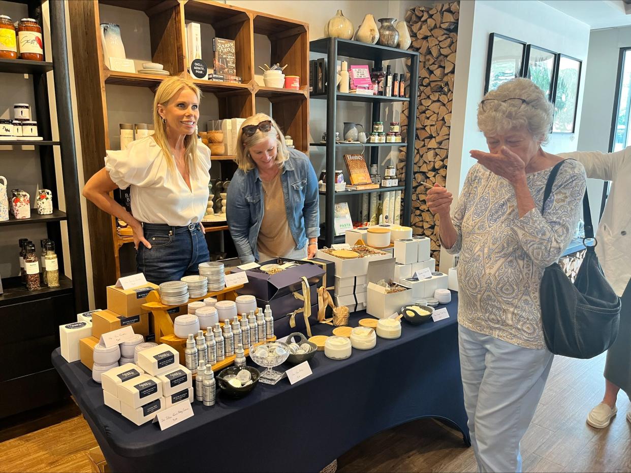 Actress Cheryl Hines samples products from her Hines+Young collection during a pop-up launch event at Hearth and Soul.
