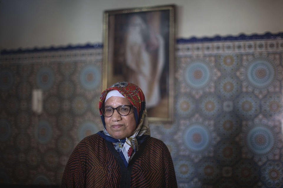 Ghita Naoui is seen inside her home as she spends Eid in lockdown with her family members due to the Coronavirus pandemic, in Sale, Morocco, Sunday, May 24, 2020. Instead of mass prayers and large family gatherings filled with colorful clothes, gifts, and traditional foods, millions of Moroccan Muslims celebrated Eid Al-Fitr at home, subdued and isolated amid their country's newly extended coronavirus lockdown. (AP Photo/Mosa'ab Elshamy)