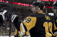 Pittsburgh Penguins' Reilly Smith (19) celebrates after scoring against the Nashville Predators during the second period of an NHL hockey game, Monday, April 15, 2024, in Pittsburgh. (AP Photo/Matt Freed)