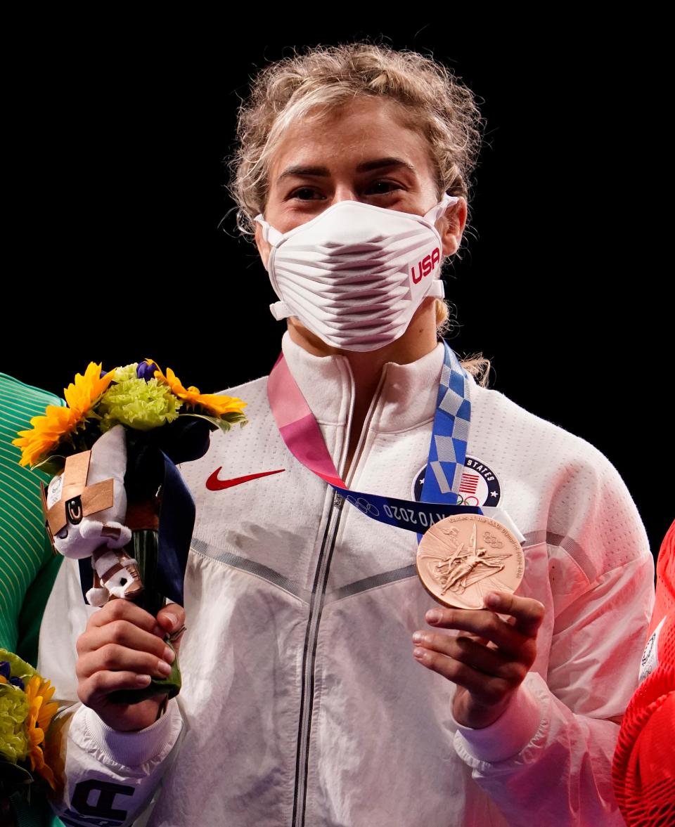 Helen Maroulis celebrates her bronze medal in the women's freestyle 57kg.