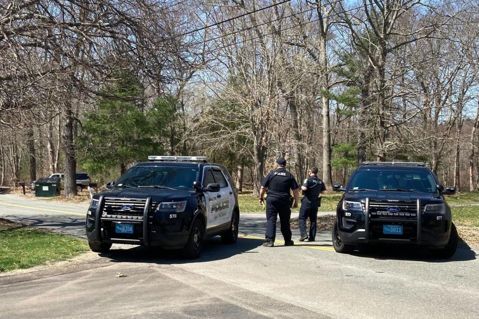 Police block a road in North Dighton, Mass., Thursday, April 13, 2023. The FBI wants to question a 21-year-old member of the Massachusetts Air National Guard in connection with the disclosure of highly classified military documents on the Ukraine war, two people familiar with the investigation said Thursday. (AP Photo/Michelle R. Smith)