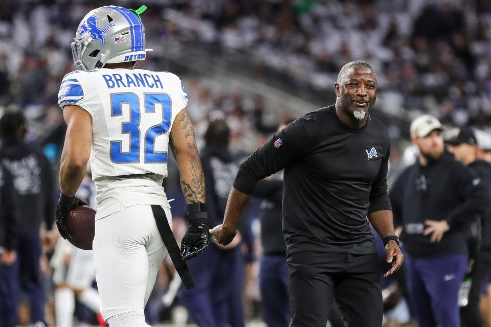 Detroit Lions defensive coordinator Aaron Glenn shakes hands with safety Brian Branch before the Dallas Cowboys game at AT&T Stadium in Arlington, Texas on Saturday, Dec. 30, 2023.