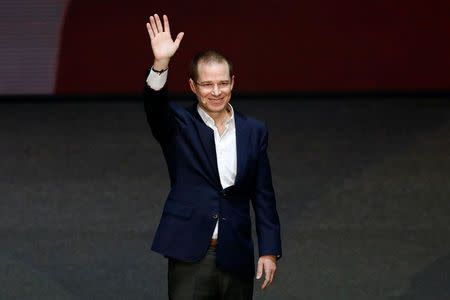 Ricardo Anaya waves to supporters after being sworn-in as presidential candidate of the National Action Party (PAN), who leads a left-right coalition, at the Auditorio Nacional in Mexico City, Mexico February 18, 2018. REUTERS/Edgard Garrido