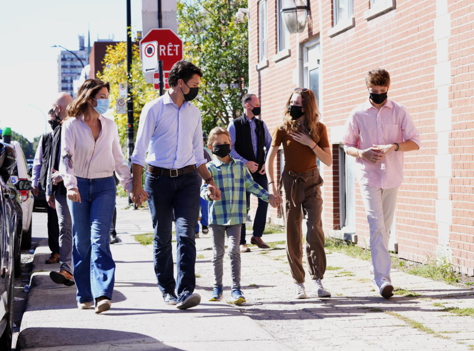 Liberal leader Justin Trudeau arrives to cast his ballot in the 44th general federal election as he's joined by wife Sophie Gregoire-Trudeau, and children, Xavier, Ella-Grace and Hadrien in Montreal on Monday, Sept. 20, 2021. (Paul Chiasson/The Canadian Press via AP)