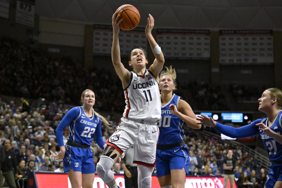 UConn's Lou Lopez-Senechal (11) shoots against Creighton during the second half of an NCAA college basketball game Wednesday, Feb. 15, 2023, in Storrs, Conn. (AP Photo/Jessica Hill)