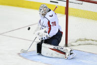 Washington Capitals goaltender Braden Holtby (70) stops the puck during the third period of an NHL hockey game against the Philadelphia Flyers, Sunday, March 24, 2019, in Washington. The Capitals won 3-1. (AP Photo/Nick Wass)