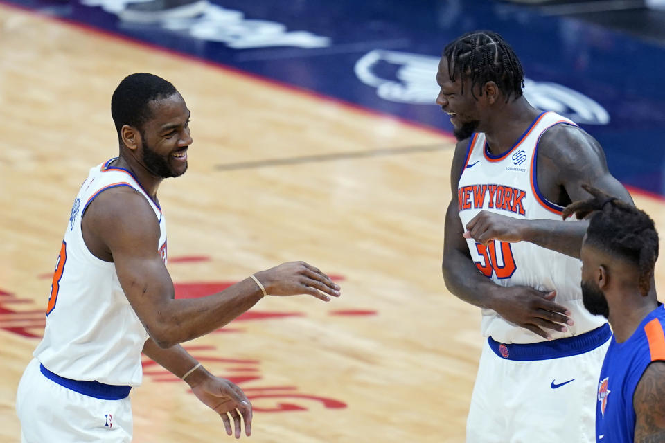 New York Knicks guard Alec Burks celebrates his 3-point basket with forward Julius Randle (30) in the second half of an NBA basketball game against the New Orleans Pelicans in New Orleans, Wednesday, April 14, 2021. The Knicks won 116-106. (AP Photo/Gerald Herbert)