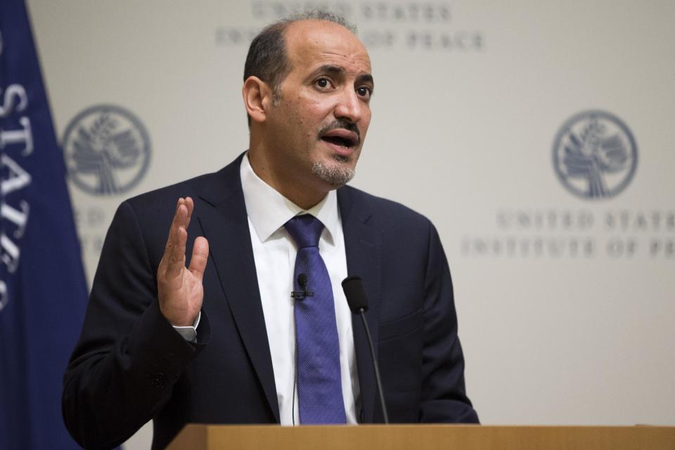 President Ahmad al-Jarba, president of the National Coalition for Syrian Revolutionary and Opposition Forces, speaks at the U.S. Institute of Peace, on Wednesday, May 7, 2014, in Washington. Al-Jarba said that rebel forces need weapons that could “neutralize’’ aerial raids by President Bashar Assad’s air force in order to change the balance of power on the ground and pave the way for a political solution to the crisis. (AP Photo/ Evan Vucci)