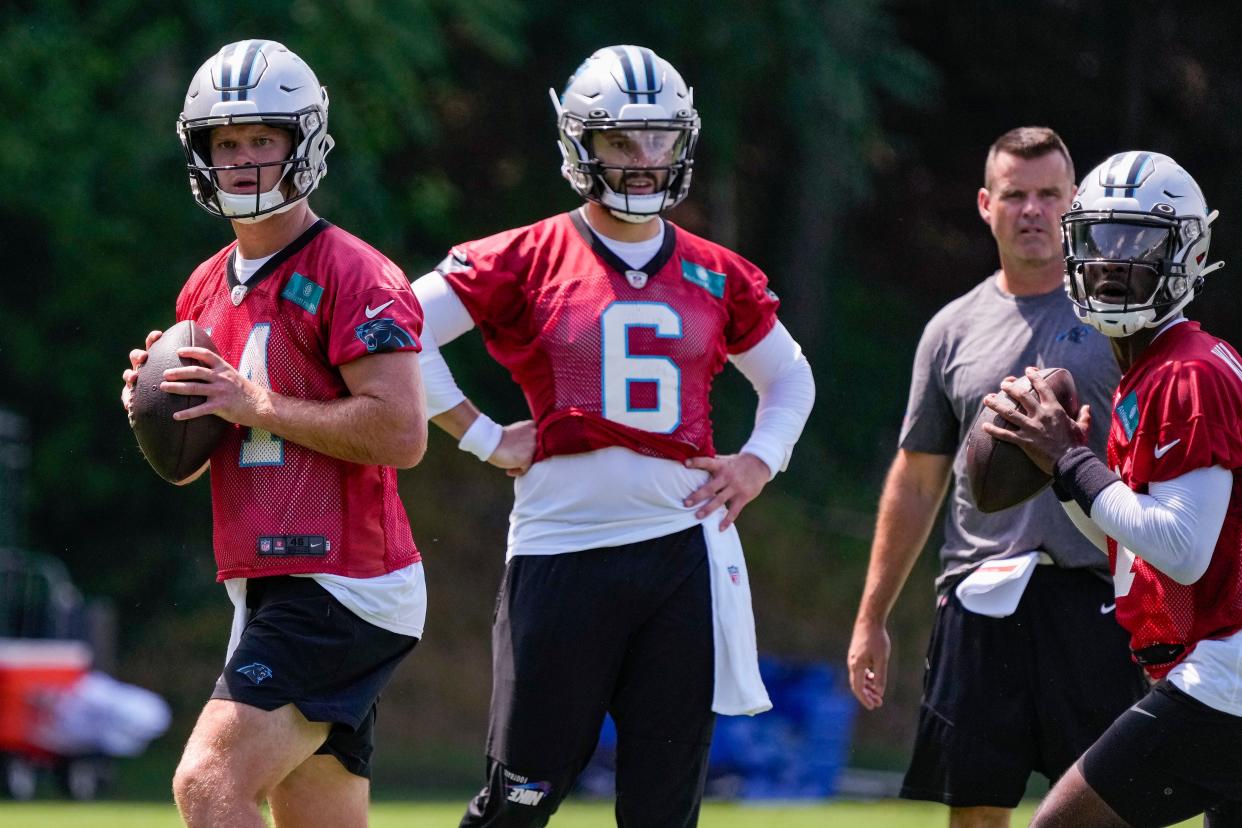 Fifth-year QBs Baker Mayfield (6) and Sam Darnold are vying for the Panthers starting job this summer.