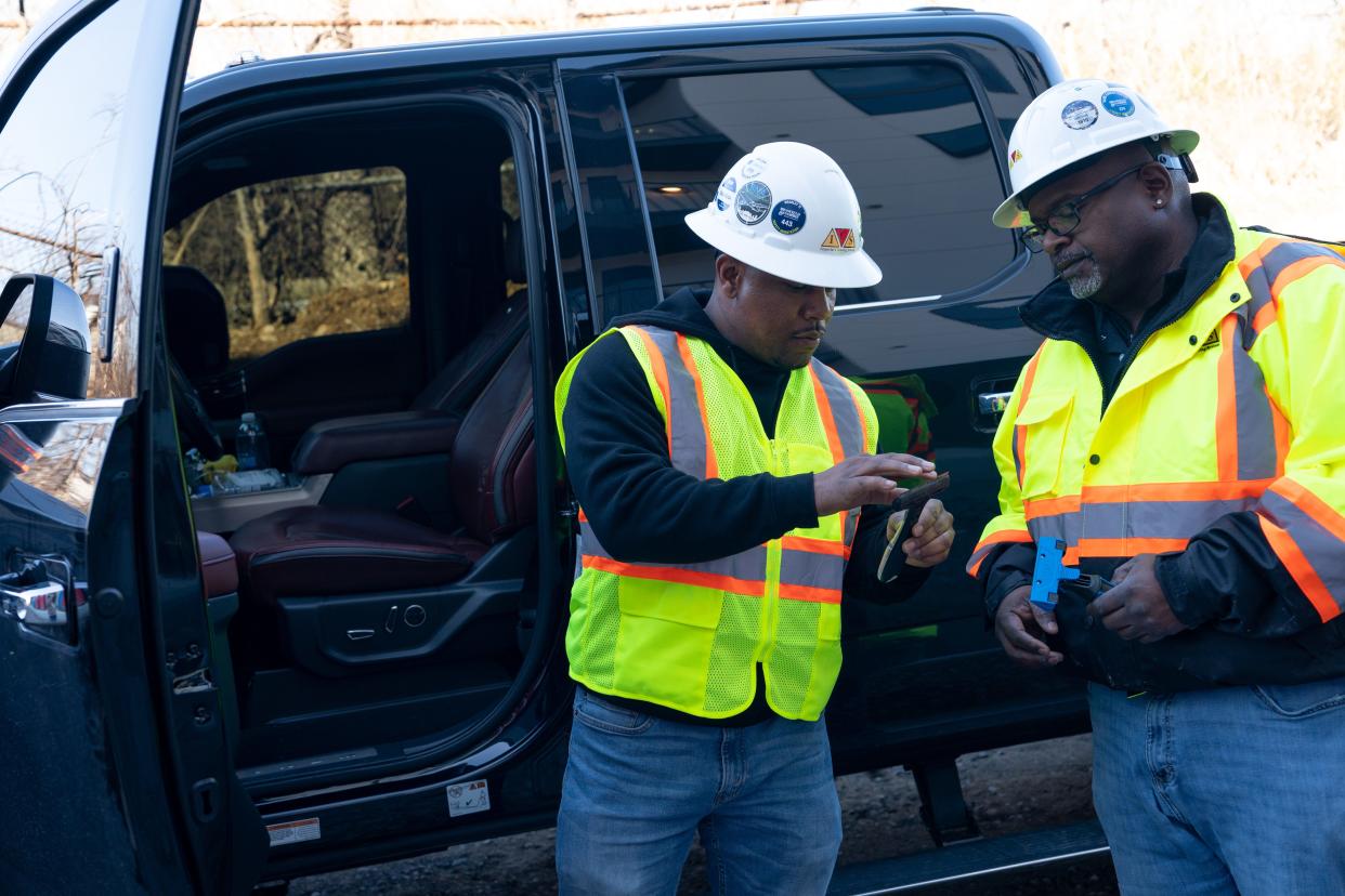 Robert Sherrill, CEO of Imperial Cleaning Systems, a company he started from the ground up, discusses supplies with Patrick Johnson, operations manager at an East Nashville job site.