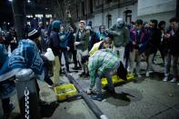 <p>People break a traffic light while celebrating the Philadelphia Eagles’ victory in Super Bowl LII game against the New England Patriots on February 4, 2018 in Philadelphia, Pennsylvania..(Photo by Eduardo Munoz Alvarez/Getty Images) </p>