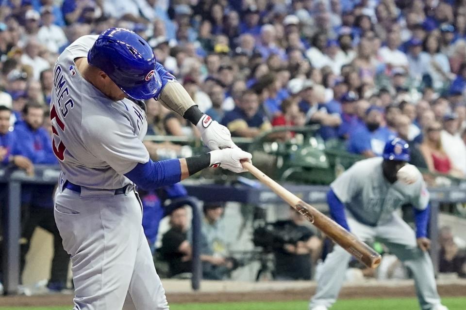FILE - Chicago Cubs' Yan Gomes hits a grand slam during the first inning of a baseball game against the Milwaukee Brewers, Sept. 30, 2023, in Milwaukee. Pitcher Kyle Hendricks' $16 million option for 2024 was exercised Sunday, Nov. 5, 2023, by the Cubs, who also exercised a $6 million option on catcher Gomes. (AP Photo/Morry Gash, File)