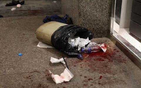 View of a blood-splattered floor after an alleged pro-Chinese supporter attacked a pro-democracy protester - Credit: JEROME FAVRE/EPA-EFE/REX