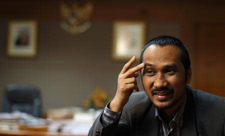 Corruption Eradication Agency (KPK) chief Abraham Samad gestures during an interview at his officec in Jakarta April 10, 2013. REUTERS/Beawiharta