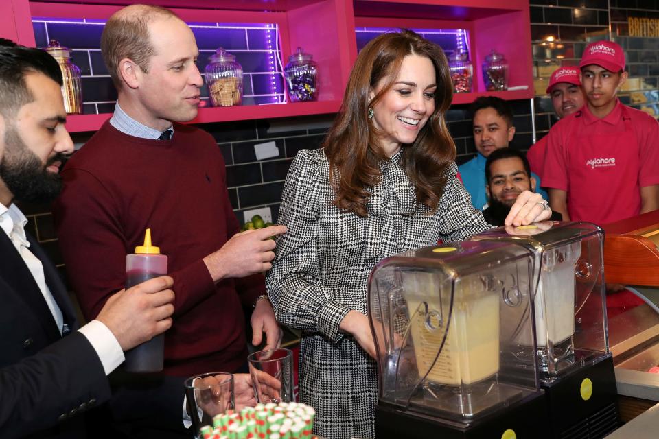 Prince William and Duchess Kate help make glasses of Kulfi lassi during their Bradford visit on Jan. 15, 2020.