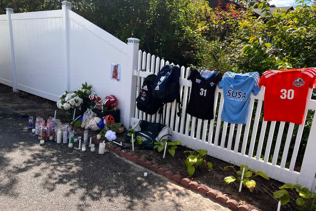 <p>Claudia Stinson</p> A memorial outside of Anthony Stinson's home in Long Island.