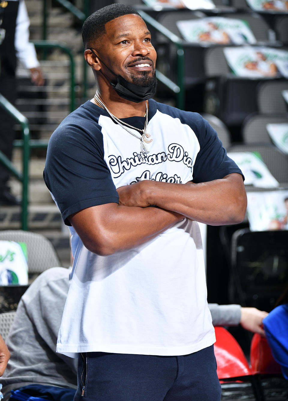 <p>Jamie Foxx flashes a smile before the Dallas Mavericks and Washington Wizards basketball game at the American Airlines Center in Dallas on Nov. 27.</p>