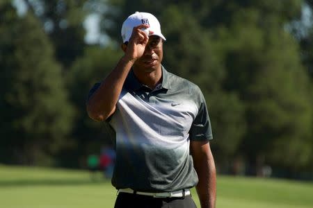 Tiger Woods acknowledges the crowd after making a putt on the 15th hole in the second round of the Quicken Loans National golf tournament at Robert Trent Jones Golf Club. Mandatory Credit: Rafael Suanes-USA TODAY Sports