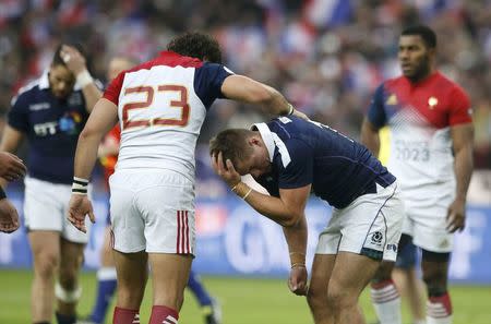 Rugby Union - Six Nations Championship - France v Scotland - Stade de France, Saint-Denis near Paris, France - 12/2/2017. France's Yoann Huget (L) and Scotland's Huw Jones at the end of the match. REUTERS/Pascal Rossignol