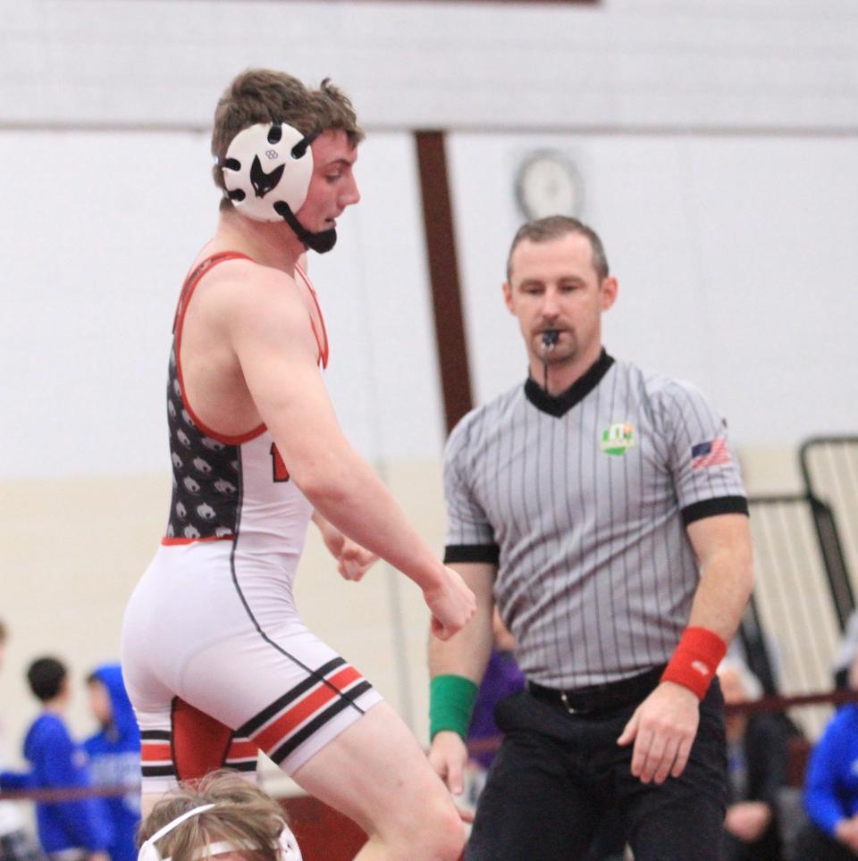 Newark senior Calvin Untied celebrates his pin of Teays Valley junior Wesley Henderson in the 144-pound final during the Division I sectional championships at Newark on Saturday, Feb. 25, 2023.