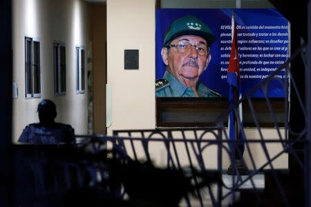 A picture of Raul Castro is seen at an office in Havana, Cuba April 18, 2018. REUTERS/Stringer/Files