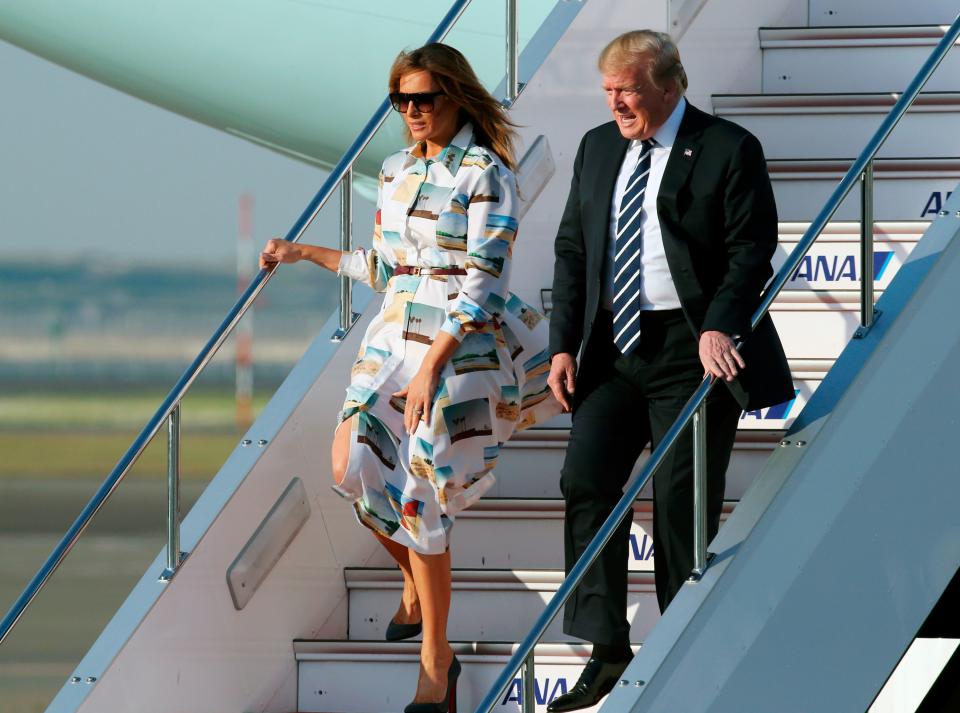 Melania Trump touched down in Japan for a four-day state visit in a Calvin Klein shirt dress emblazoned with old postcards. She finished the flight-ready ensemble with a pair of Christian Louboutin heels. [Photo: Getty]