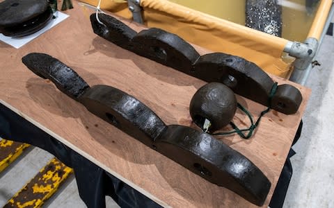 Wooden block used for hauling sails up the masts, recovered from HMS Invincible.  - Credit: BNPS