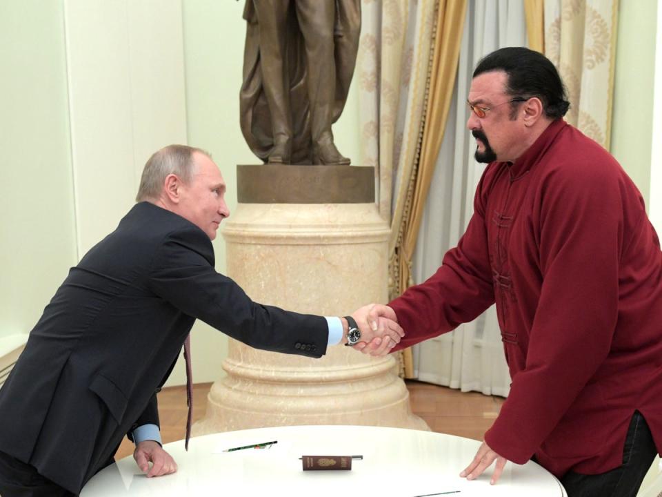 Vladimir Putin and Steven Seagal pictured in 2016 (AFP via Getty Images)
