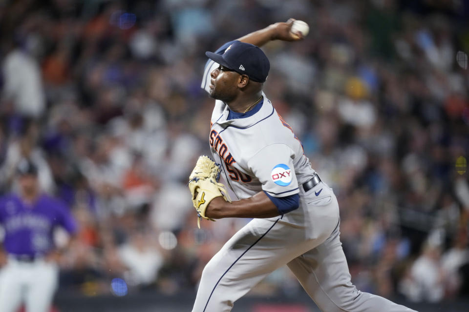 Houston Astros relief pitcher Hector Neris works against the Colorado Rockies during the seventh inning of a baseball game Tuesday, July 18, 2023, in Denver. (AP Photo/David Zalubowski)