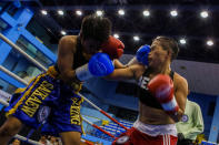 Huang Wensi fights in her match against Thailand's Jarusiri Rongmuang for the Asia Female Continental Super Flyweight Championship gold belt in Taipei, Taiwan, September 26, 2018. REUTERS/Yue Wu